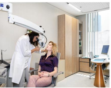 A physician with a patient in an Acıbadem consultation room